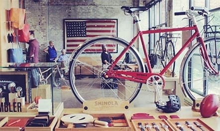 A picture inside a store with a bicycle in frame